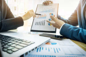 team work process young business managers crew working with new startup project labtop wood table typing keyboard texting message analyse graph plans